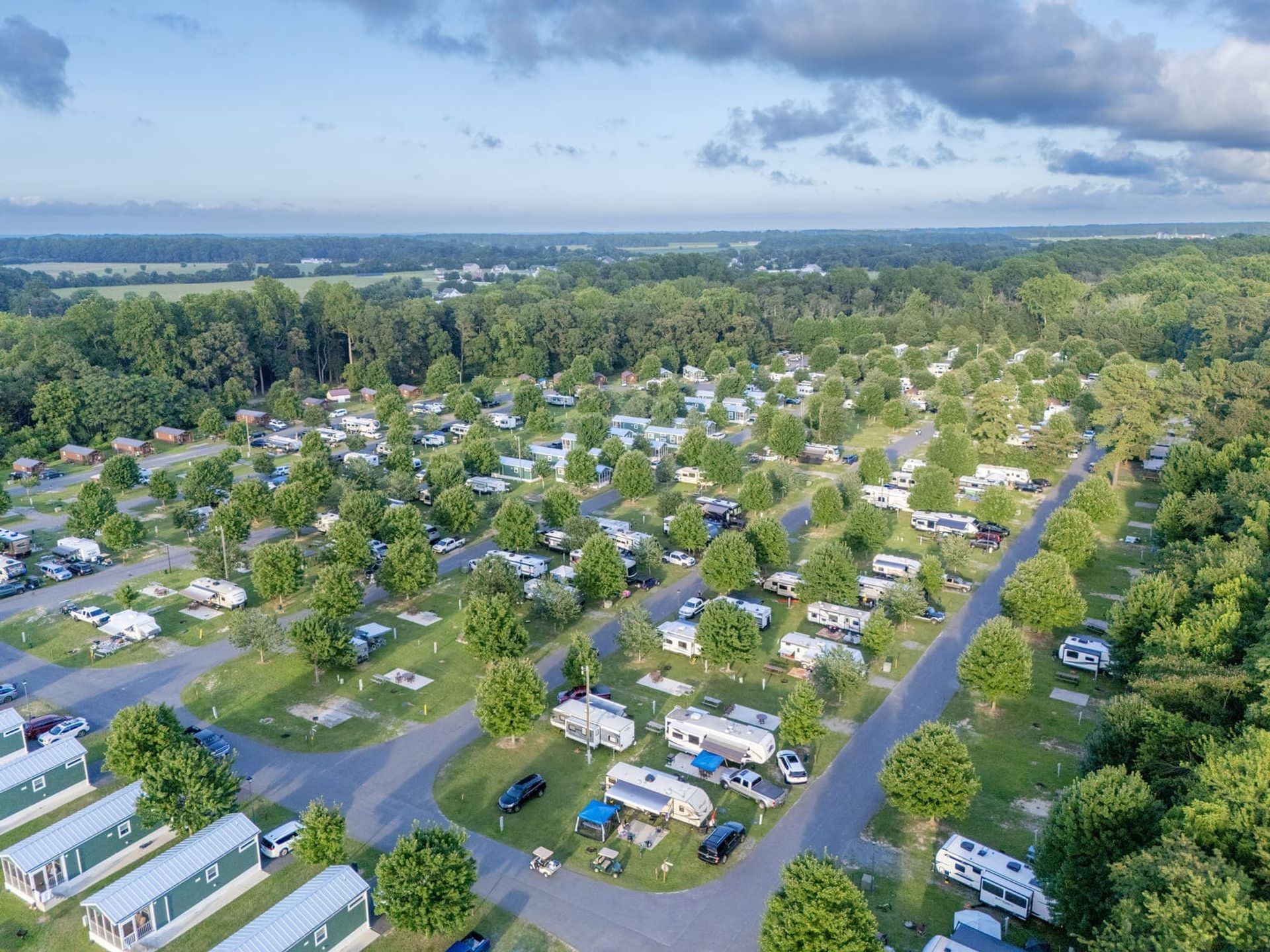 Aerial photograph of a Lewes Delaware campground with RV sites, trees, and open space