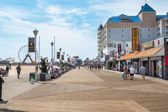 Ocean City Maryland boardwalk with shops and Ferris wheel